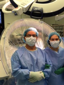 Neurosurgeon couple in operating room.